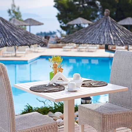 Alia Palace Hotel - Adults Only 16+ Chalkidiki Eksteriør billede A poolside table at a hotel
